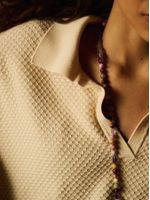 Blusa longa feminina de tricô com gola polo e manga curta, da Anselmi