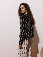 Calça pantalona feminina de tricô bicolor em ponto Ondas, da Anselmi