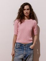 Blusa feminina de tricô com tranças em relevo e manga curta, da Anselmi